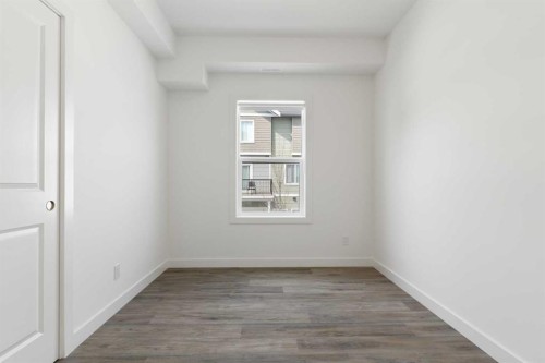 401-24 Rivercrest Drive, Cochrane, AB - Indoor Photo Showing Other Room