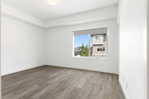 401-24 Rivercrest Drive, Cochrane, AB - Indoor Photo Showing Other Room