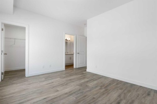 401-24 Rivercrest Drive, Cochrane, AB - Indoor Photo Showing Other Room