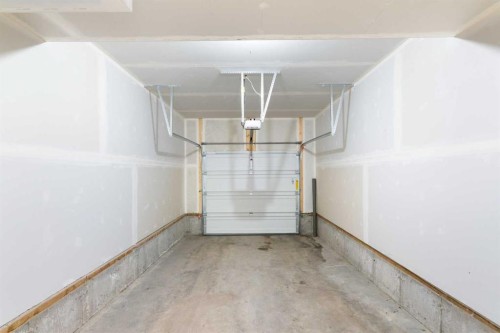 401-24 Rivercrest Drive, Cochrane, AB - Indoor Photo Showing Garage