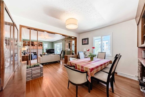 3604 Parkhill Street Sw, Calgary, AB - Indoor Photo Showing Dining Room With Fireplace
