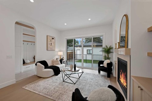 2221 Halifax Crescent Nw, Calgary, AB - Indoor Photo Showing Living Room With Fireplace