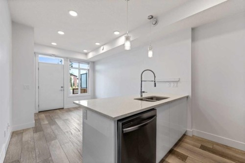 19645 48 Street Se, Calgary, AB - Indoor Photo Showing Kitchen With Double Sink