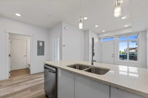 19645 48 Street Se, Calgary, AB - Indoor Photo Showing Kitchen With Double Sink