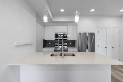 19645 48 Street Se, Calgary, AB - Indoor Photo Showing Kitchen With Double Sink With Upgraded Kitchen