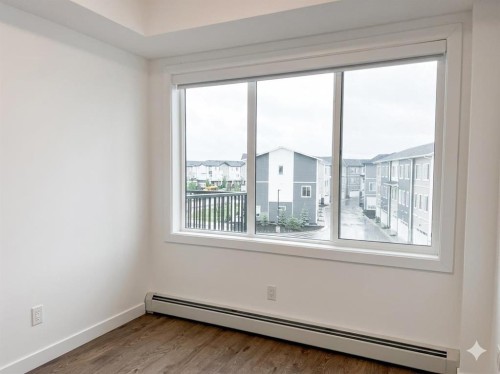 1314-6 Merganger Drive West, Chestermere, AB - Indoor Photo Showing Other Room