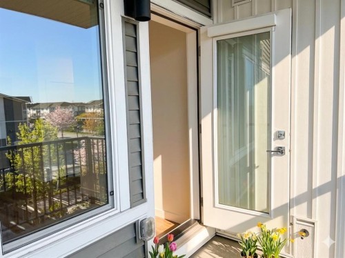1314-6 Merganger Drive West, Chestermere, AB - Outdoor With Balcony With Exterior