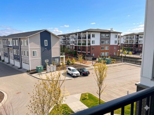 1314-6 Merganger Drive West, Chestermere, AB - Outdoor With Balcony With Exterior