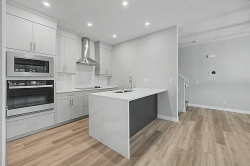 142 Sovereign Common Sw, Calgary, AB - Indoor Photo Showing Kitchen With Upgraded Kitchen