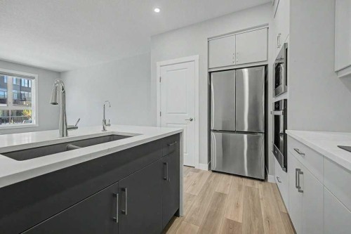 142 Sovereign Common Sw, Calgary, AB - Indoor Photo Showing Kitchen With Double Sink