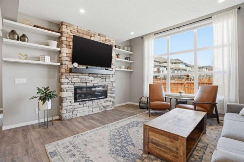 393 Masters Avenue Se, Calgary, AB - Indoor Photo Showing Living Room With Fireplace