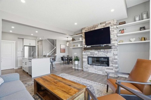 393 Masters Avenue Se, Calgary, AB - Indoor Photo Showing Living Room With Fireplace