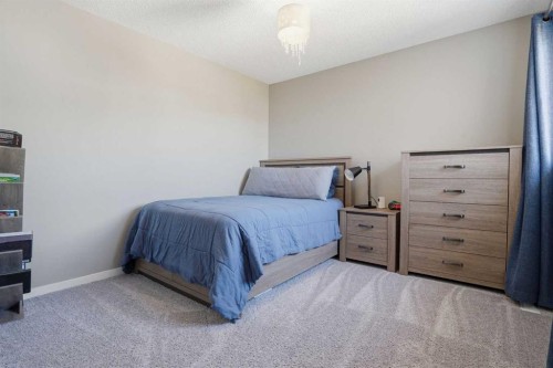 393 Masters Avenue Se, Calgary, AB - Indoor Photo Showing Bedroom