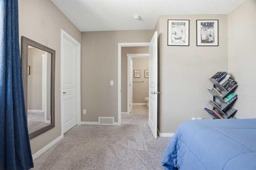 393 Masters Avenue Se, Calgary, AB - Indoor Photo Showing Bedroom