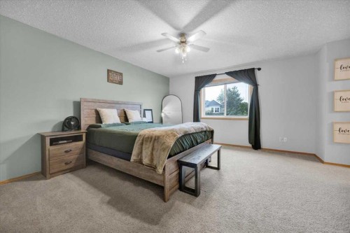 917 High Park Way Nw, High River, AB - Indoor Photo Showing Bedroom