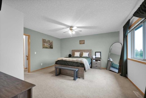 917 High Park Way Nw, High River, AB - Indoor Photo Showing Bedroom