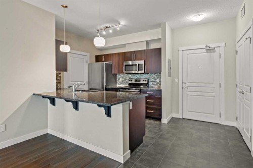408-2300 Evanston Square Nw, Calgary, AB - Indoor Photo Showing Kitchen With Stainless Steel Kitchen With Upgraded Kitchen