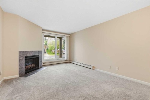 723-6400 Coach Hill Road Sw, Calgary, AB - Indoor With Fireplace