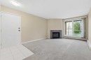 723-6400 Coach Hill Road Sw, Calgary, AB  - Indoor Photo Showing Other Room With Fireplace 