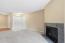 723-6400 Coach Hill Road Sw, Calgary, AB  - Indoor Photo Showing Living Room With Fireplace 