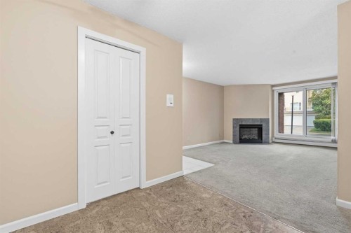723-6400 Coach Hill Road Sw, Calgary, AB - Indoor With Fireplace