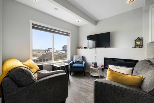 836 Edgefield Street, Strathmore, AB - Indoor Photo Showing Living Room With Fireplace