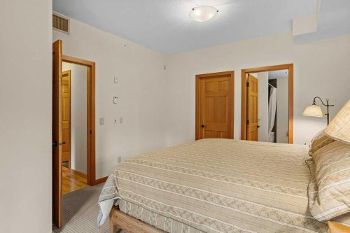 202-505 Spring Creek Drive, Canmore, AB - Indoor Photo Showing Bedroom
