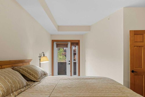 202-505 Spring Creek Drive, Canmore, AB - Indoor Photo Showing Bedroom