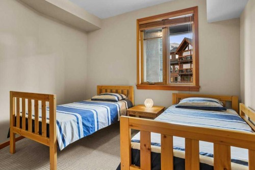 202-505 Spring Creek Drive, Canmore, AB - Indoor Photo Showing Bedroom