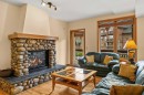 202-505 Spring Creek Drive, Canmore, AB  - Indoor Photo Showing Living Room With Fireplace 