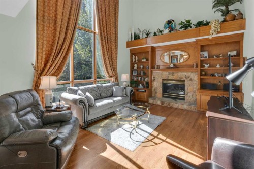 4 Hamptons Heath Nw, Calgary, AB - Indoor Photo Showing Living Room With Fireplace