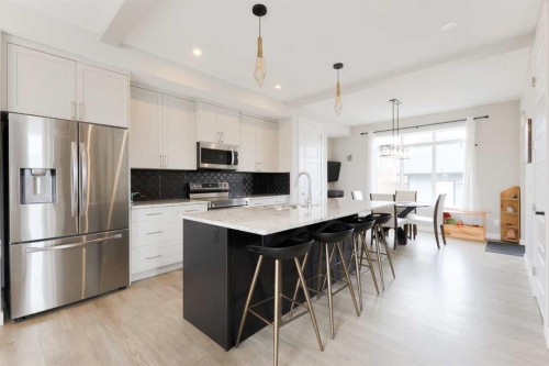 41 Precedence Glen, Cochrane, AB - Indoor Photo Showing Kitchen With Upgraded Kitchen