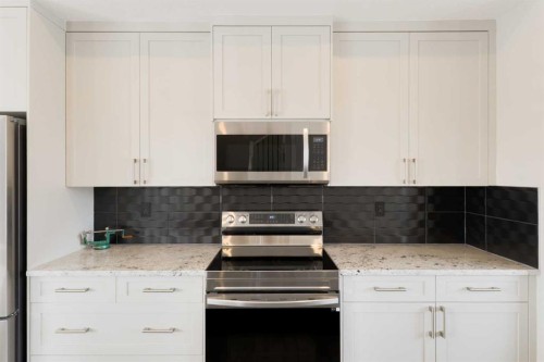 41 Precedence Glen, Cochrane, AB - Indoor Photo Showing Kitchen