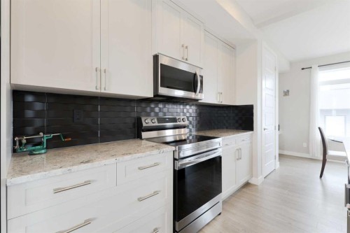 41 Precedence Glen, Cochrane, AB - Indoor Photo Showing Kitchen
