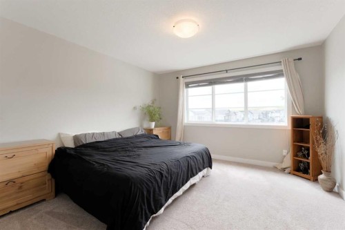41 Precedence Glen, Cochrane, AB - Indoor Photo Showing Bedroom