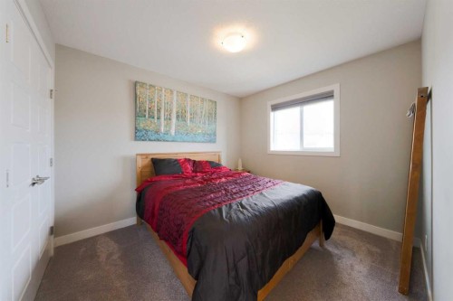 41 Precedence Glen, Cochrane, AB - Indoor Photo Showing Bedroom