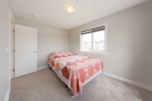 41 Precedence Glen, Cochrane, AB - Indoor Photo Showing Bedroom