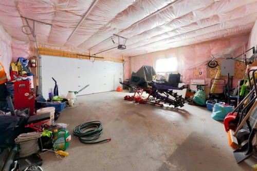 41 Precedence Glen, Cochrane, AB - Indoor Photo Showing Garage
