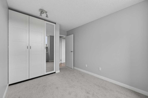 902-145 Point Drive Nw, Calgary, AB - Indoor Photo Showing Other Room