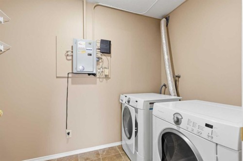 307-105 7 Avenue Se, High River, AB - Indoor Photo Showing Laundry Room