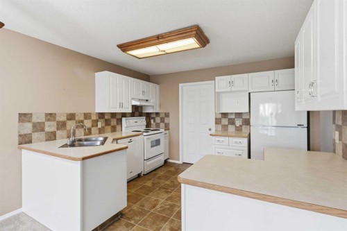 307-105 7 Avenue Se, High River, AB - Indoor Photo Showing Kitchen With Double Sink