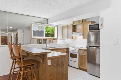 19 Templevale Way Ne, Calgary, AB - Indoor Photo Showing Kitchen With Double Sink
