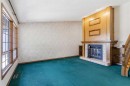 19 Templevale Way Ne, Calgary, AB  - Indoor Photo Showing Other Room With Fireplace 