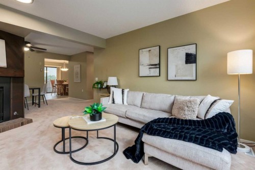 10-3302 50 Street Nw, Calgary, AB - Indoor Photo Showing Living Room With Fireplace