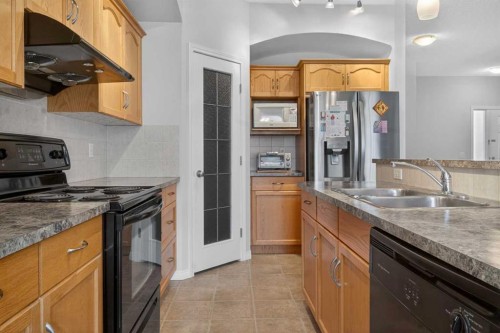 156 Saddlecrest Park Ne, Calgary, AB - Indoor Photo Showing Kitchen With Double Sink
