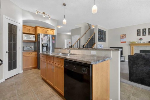 156 Saddlecrest Park Ne, Calgary, AB - Indoor Photo Showing Kitchen With Double Sink
