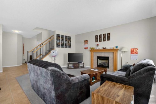 156 Saddlecrest Park Ne, Calgary, AB - Indoor Photo Showing Living Room With Fireplace