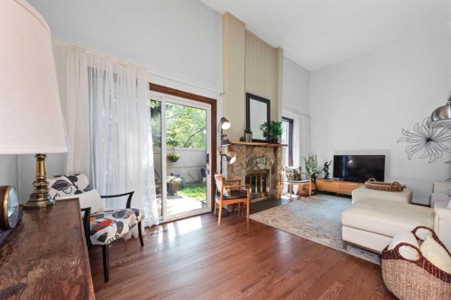 49-27 Silver Springs Drive Nw, Calgary, AB - Indoor Photo Showing Living Room With Fireplace