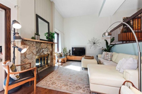 49-27 Silver Springs Drive Nw, Calgary, AB - Indoor Photo Showing Living Room With Fireplace