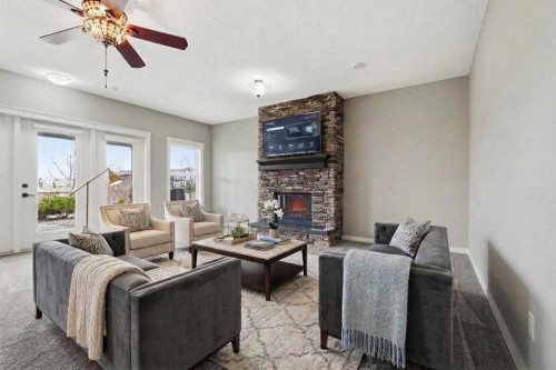 9 Kingsbridge Place Se, Airdrie, AB - Indoor Photo Showing Living Room With Fireplace